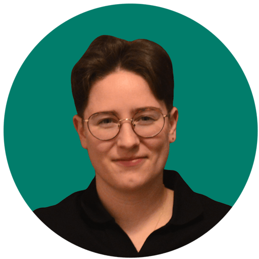 portrait photo of woman with short dark hair and glasses in a black polo shirt against an aqua-green background